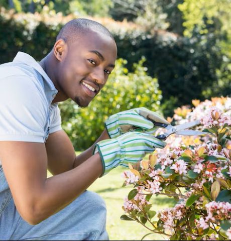 young-man-cutting-flowers_107420-29996